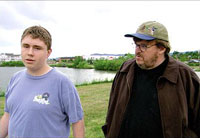 Michael Moore talks with Mark Taylor, a survivor of the Columbine High School shooting, in "Bowling for Columbine"